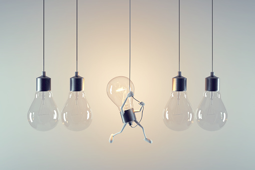 Lightbulb climbing up to the wire. Be different. Breaking free and creative mindset concept. This is a 3d render illustration