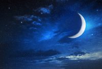 moon in a starry and cloudy sky